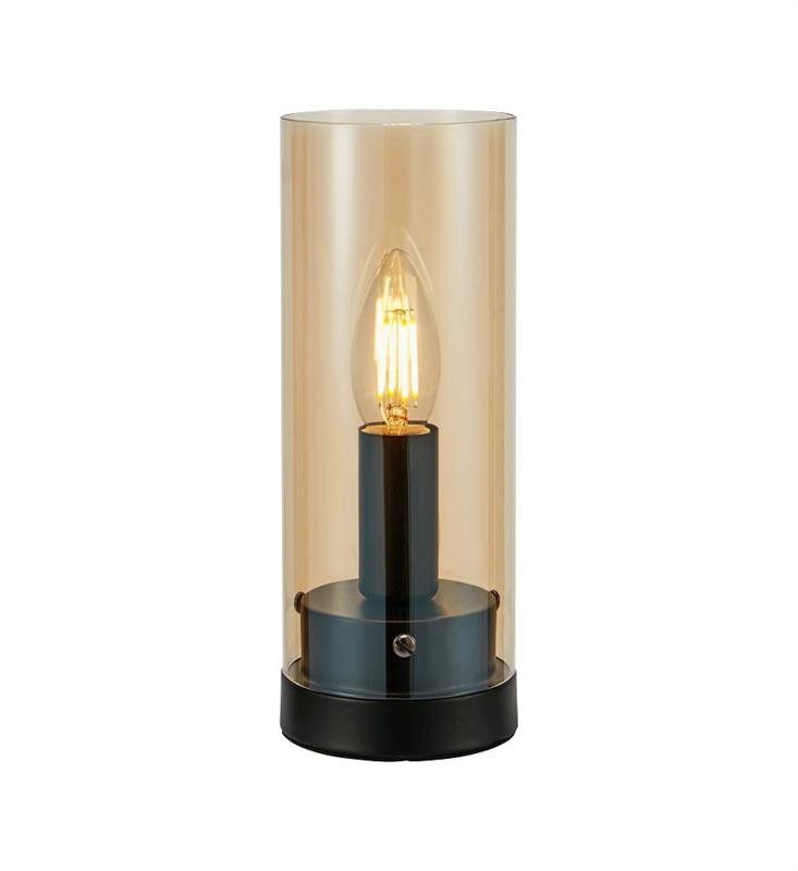Lampa stołowa z przezroczystym, cylindrycznym kloszem i widoczną żarówką wewnątrz, umieszczona na czarnej podstawie.