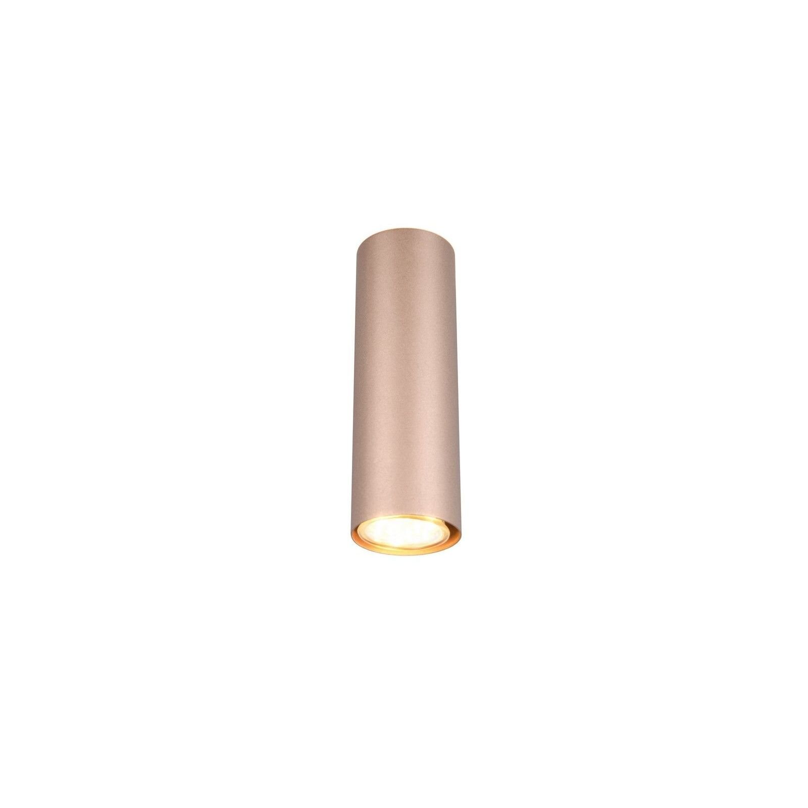 Cylindryczna lampa ścienna w kolorze złotym z widocznym źródłem światła na górze, umieszczona na białym tle.
