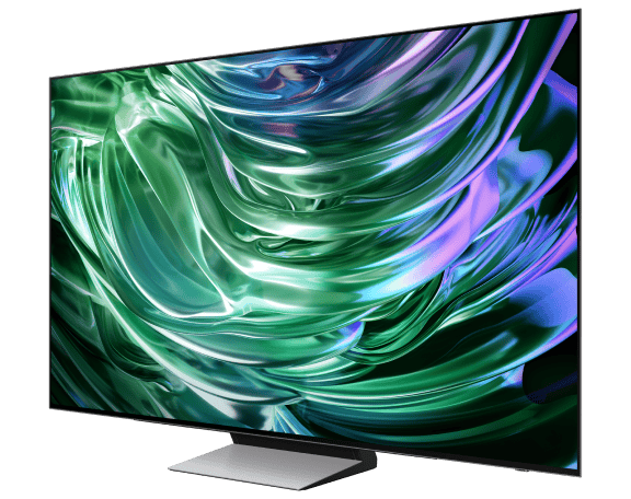 Telewizor z cienką ramką wyświetla abstrakcyjny, kolorowy wzór w odcieniach zieleni i fioletu. Ekran jest umieszczony na prostokątnej podstawie.