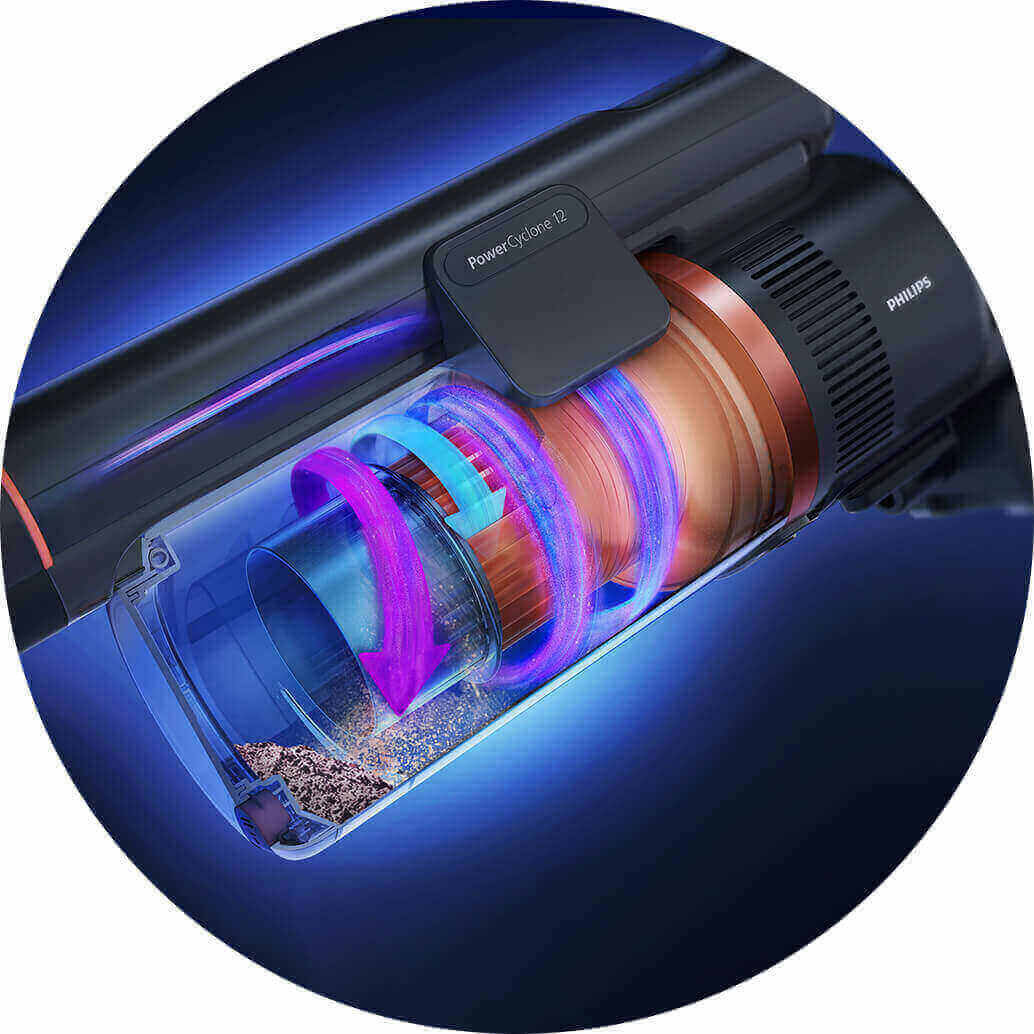 Obraz przedstawia wnętrze odkurzacza z widocznym systemem cyklonowym i kolorowymi strzałkami wskazującymi przepływ powietrza. Na obudowie widoczne są napisy \'PowerCyclone 12\' i \'PHILIPS\'.
