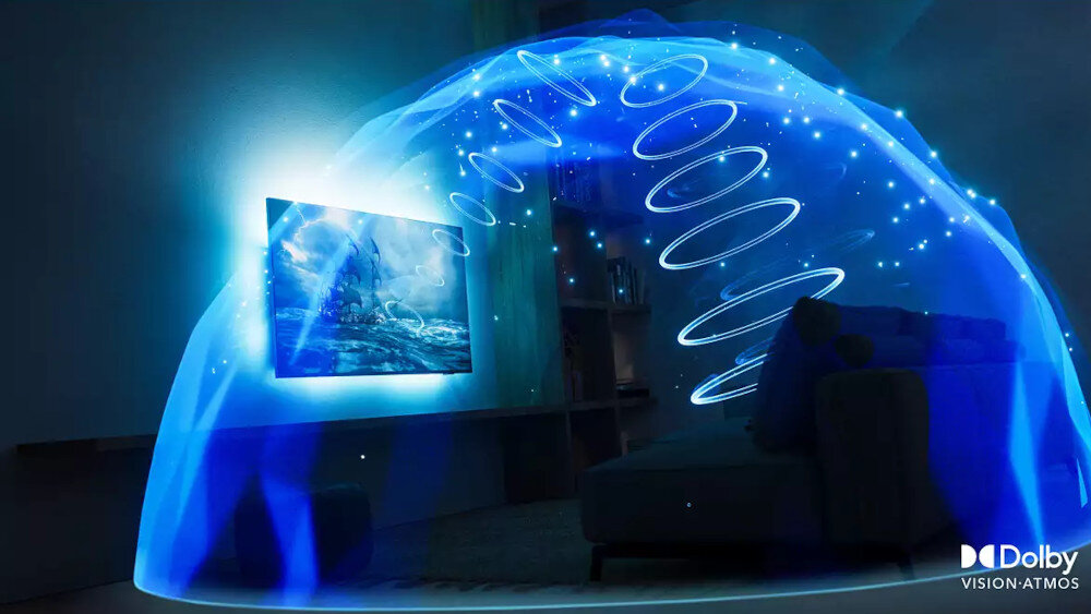 Telewizor wyświetla dynamiczny obraz z efektem świetlnym rozprzestrzeniającym się wokół. W prawym dolnym rogu widoczne jest logo \'Dolby Vision Atmos\'.