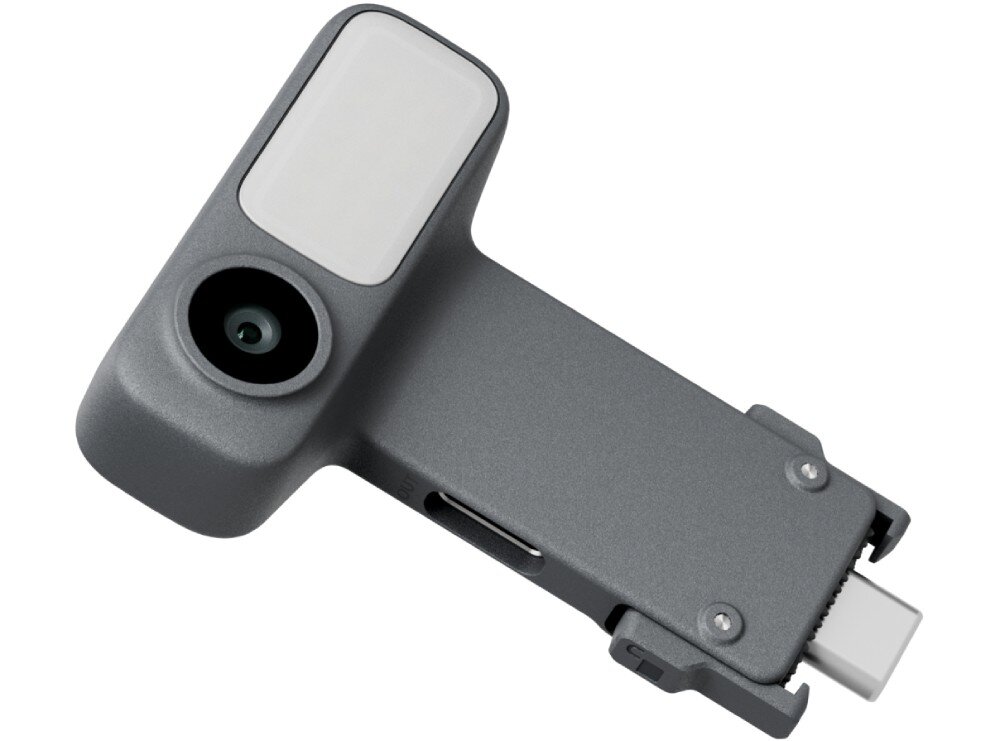 Moduł wielofunkcyjny DJI do Osmo Mobile 8P Zdjęcie produktowe na białym tle przedstawiające niewielkie, szare akcesorium o matowym wykończeniu. Urządzenie ma kształt litery T, z jednej strony posiada okrągły obiektyw i prostokątny panel lampy, lampka, jasność, regulacja
