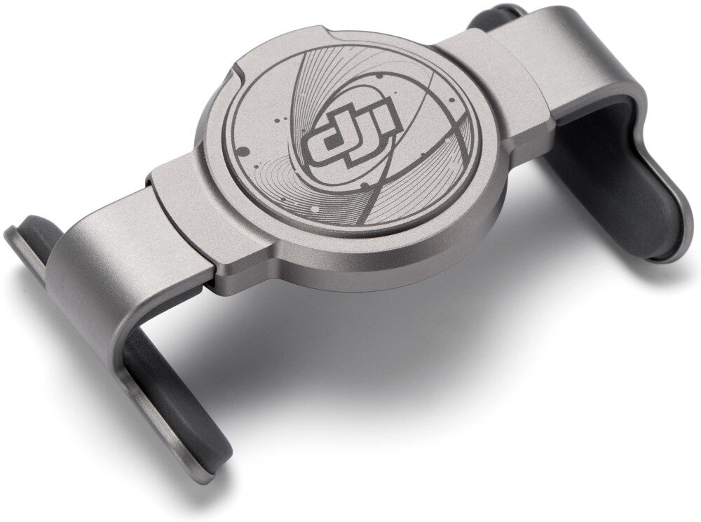 Uchwyt magnetyczny DJI Osmo Mobile Magnetyczny uchwyt na telefon w kolorze szarym pokazany pod kątem na białym tle, posiadający na okrągłym środku logo 'dji', opis