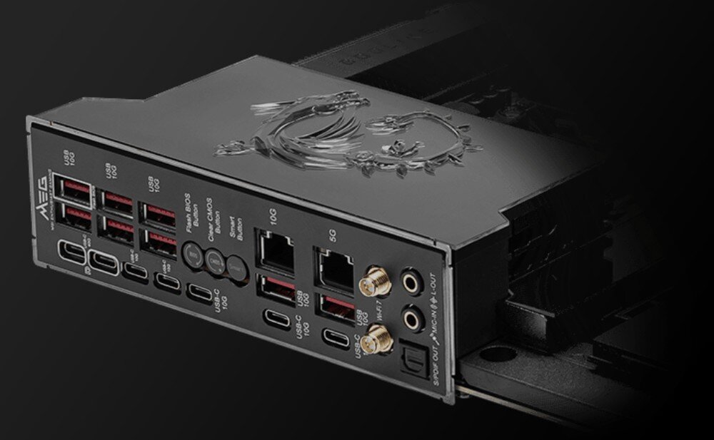 Obraz przedstawia panel tylni płyty głównej z wieloma portami USB, portami sieciowymi oraz złączami audio. Na panelu widoczne jest logo producenta w formie smoka.