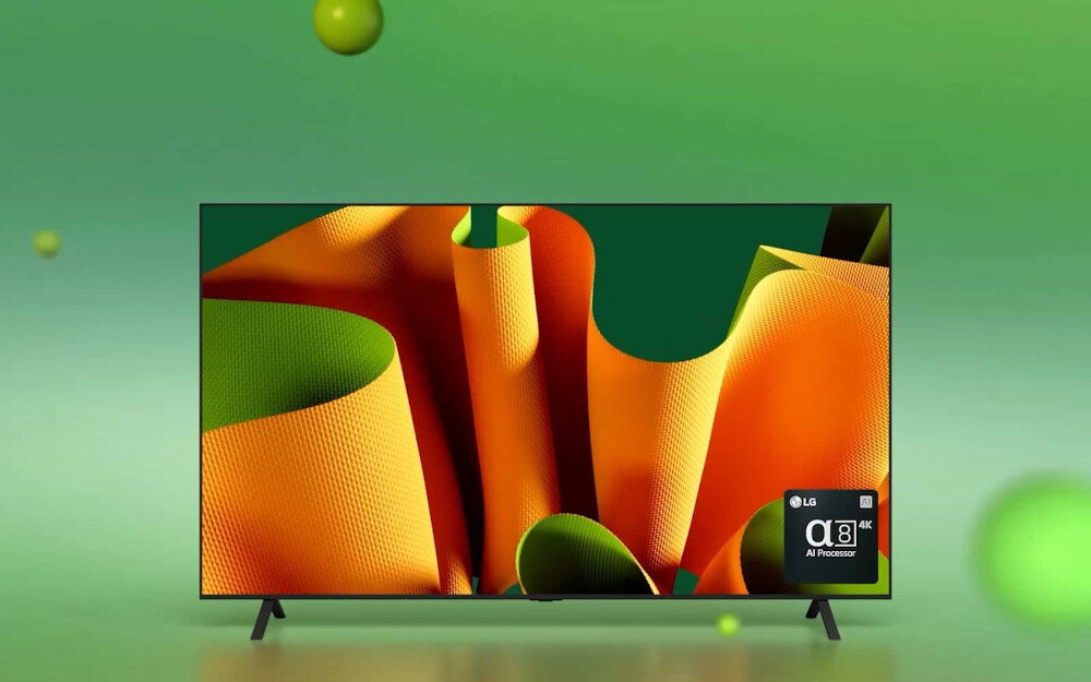 Telewizor wyświetla kolorową grafikę z dominującymi odcieniami pomarańczowego i zielonego. W prawym dolnym rogu ekranu widoczne jest logo LG oraz napis \'α9 AI Processor 4K\'.