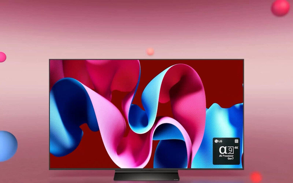 Telewizor z wyświetlaczem prezentującym kolorowe, abstrakcyjne wzory w odcieniach różu i niebieskiego. W prawym dolnym rogu ekranu widoczne jest logo LG oraz napis \'α9 AI Processor Gen7 4K\'.
