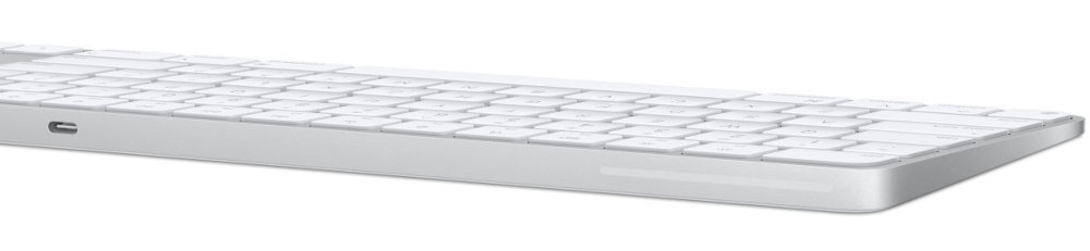 Biała klawiatura z niskoprofilowymi klawiszami, widoczna z boku. Na obudowie znajduje się port USB-C.