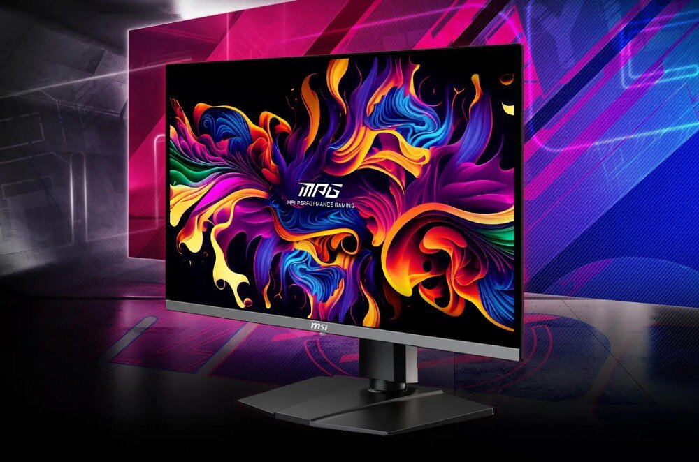 Monitor z wyświetlaczem prezentującym kolorowy, abstrakcyjny wzór z napisem \'MPG MSI PERFORMANCE GAMING\'. Obudowa monitora jest czarna, a na dolnej ramce widoczne jest logo \'MSI\'.