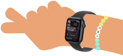 Smartwatch z ciemnym paskiem i wyświetlaczem pokazującym różne aplikacje. Widoczne kolorowe kółka z numerami od 1 do 5.