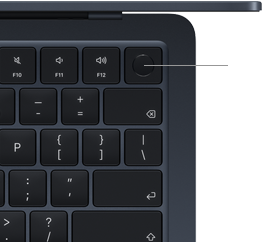 Fragment klawiatury laptopa z widocznymi klawiszami funkcyjnymi F10, F11, F12 oraz przyciskiem zasilania w górnym rogu. Klawisze mają ciemny kolor z białymi symbolami.