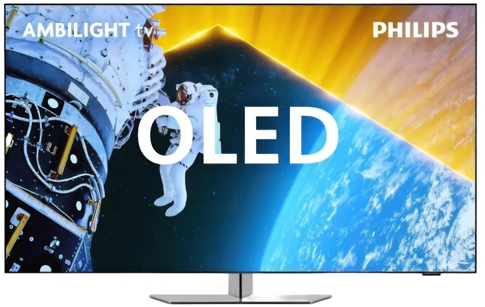 Telewizor wyświetla obraz kosmonauty w przestrzeni kosmicznej z widoczną Ziemią w tle. Na ekranie widoczny jest tekst: \'AMBILIGHT tv\', \'PHILIPS\' oraz \'OLED\'.