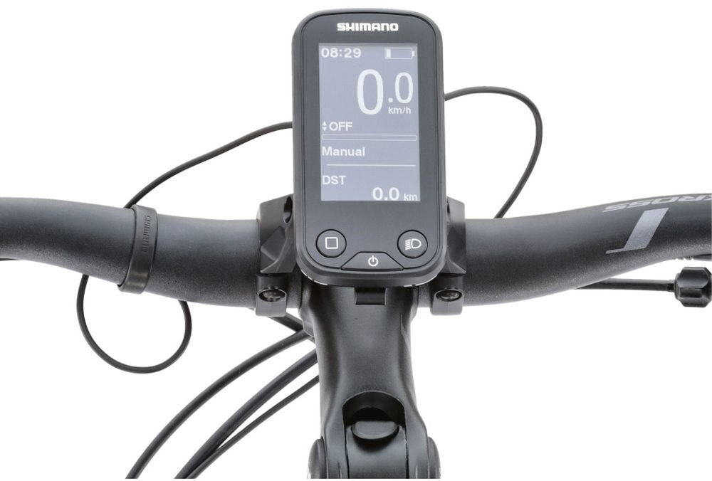Na zdjęciu widoczny jest wyświetlacz roweru elektrycznego z logo Shimano, zamontowany na kierownicy. Ekran pokazuje informacje: 08:29, 0.0 km/h, +OFF, Manual, DST 0.0 km.