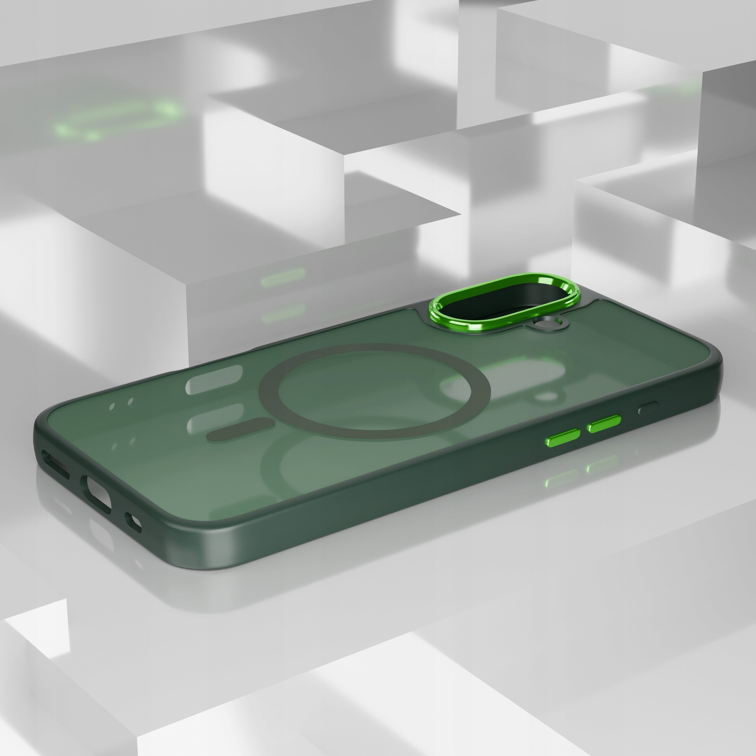 Na obrazie widoczne jest matowe, zielone etui na telefon z wycięciem na aparat i okrągłym wzorem sugerującym kompatybilność z MagSafe. Etui leży na białej, geometrycznej powierzchni.