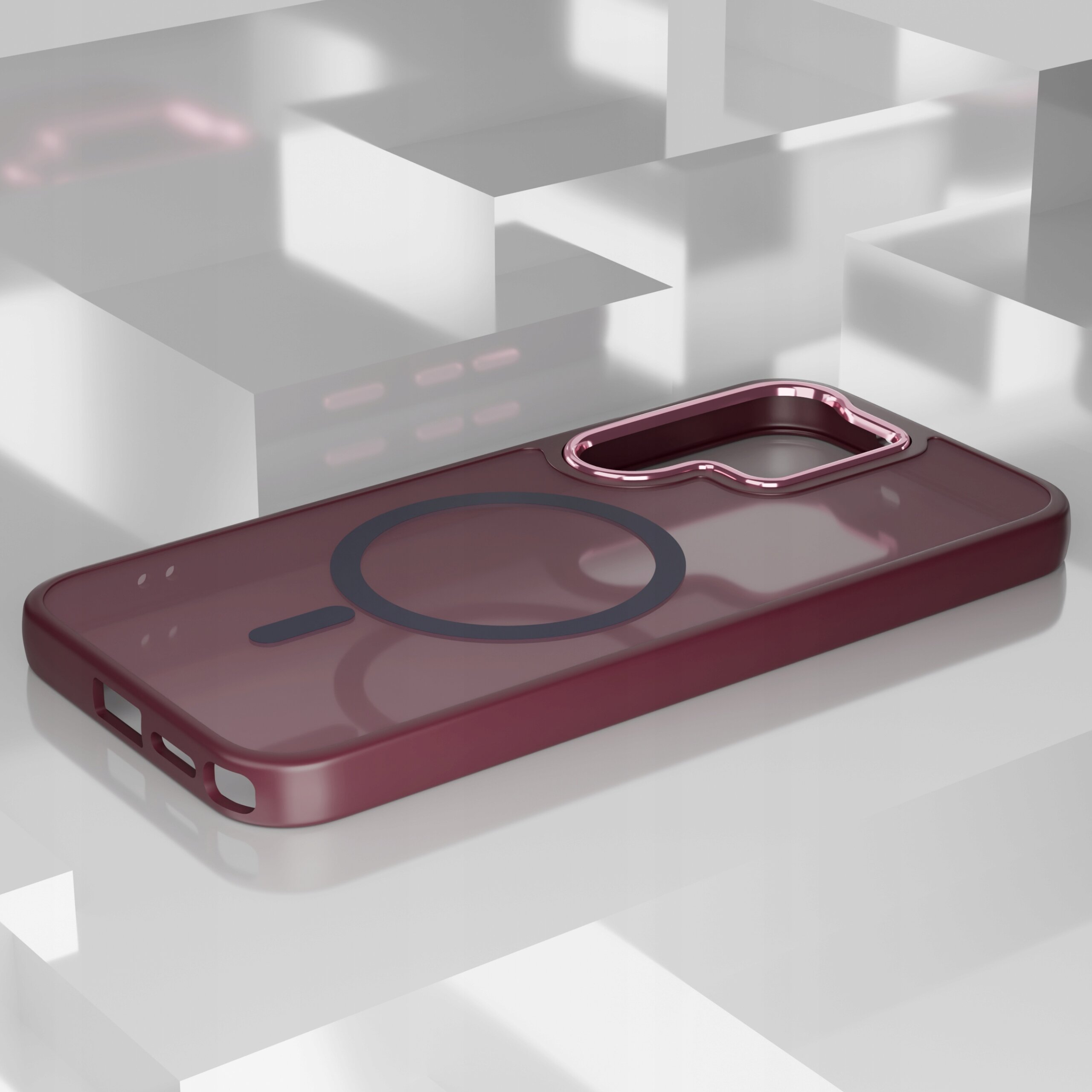 Na obrazie widoczne jest matowe, magnetyczne etui w kolorze bordowym z okrągłym wzorem na tylnej części, przeznaczone do telefonu Samsung S26 Ultra. Etui leży na jasnej, geometrycznej powierzchni.