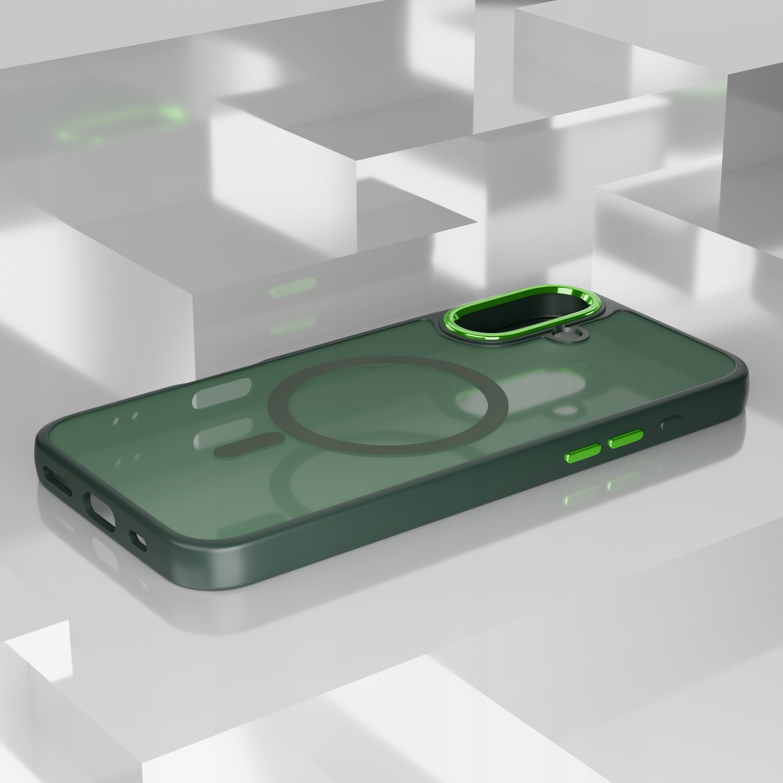 Etui do telefonu w kolorze zielonym z matowym wykończeniem i magnetycznym pierścieniem na środku. W tle widoczne są geometryczne kształty w odcieniach szarości.