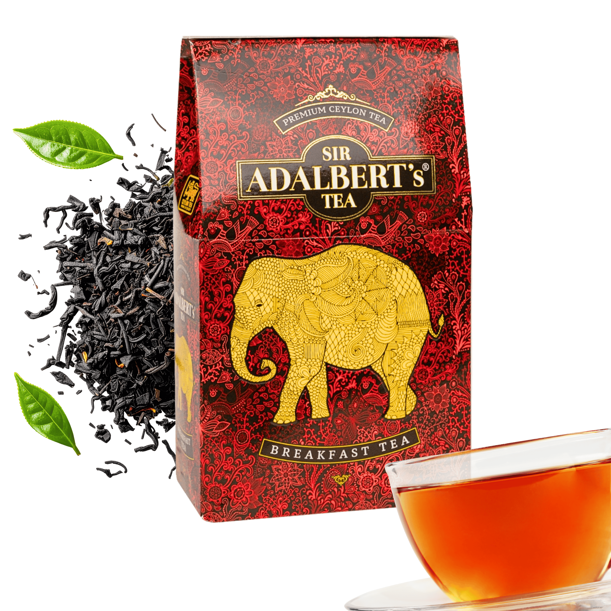 Opakowanie herbaty Sir Adalbert’s Tea z widocznym złotym słoniem na czerwonym tle oraz filiżanka z herbatą. Obok opakowania znajdują się liście herbaty i zielony liść.