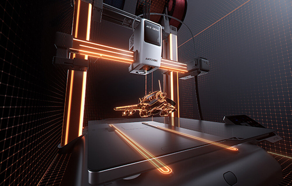 Drukarka 3D ANYCUBIC Kobra X Drukarka 3D z pomarańczowo podświetloną platformą i drukowanym modelem unoszącym się nad stołem roboczym