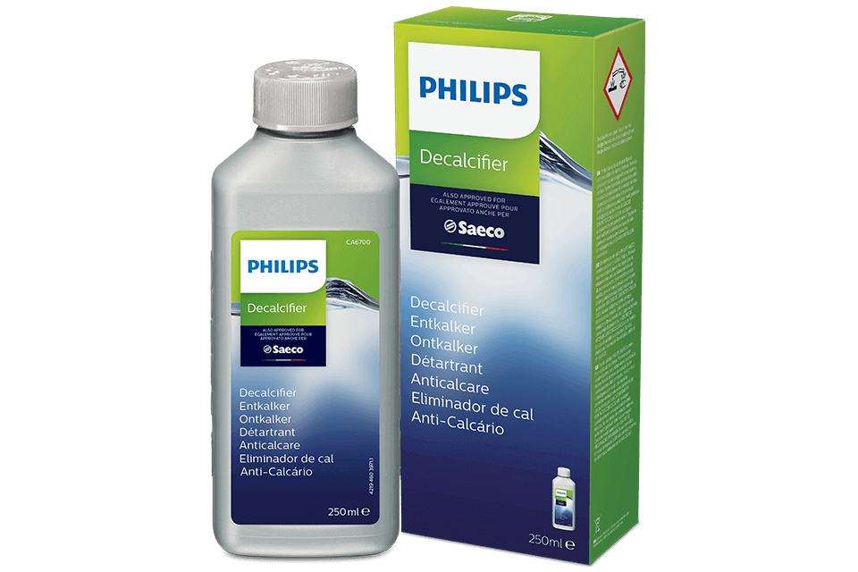 Na obrazie widoczna jest butelka i pudełko odkamieniacza marki PHILIPS. Na opakowaniu znajduje się tekst: \'Decalcifier, Entkalker, Ontkalker, Détartrant, Anticalcare, Eliminador de cal, Anti-Calcário\'.