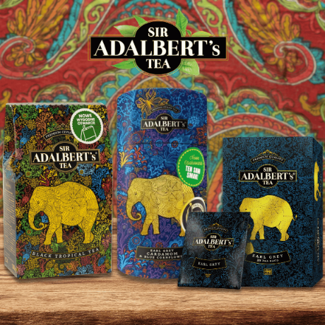 Na obrazie widoczne są opakowania herbaty marki Sir Adalbert\'s Tea z motywem słonia na tle kolorowego wzoru. Widoczny tekst to \'Black Tropical Tea\' oraz \'Earl Grey\'.