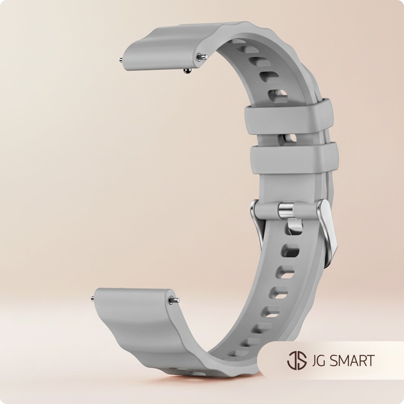 Silikonowy pasek do zegarka w kolorze szarym z metalowym zapięciem. W prawym dolnym rogu widoczne jest logo \'JG SMART\'.