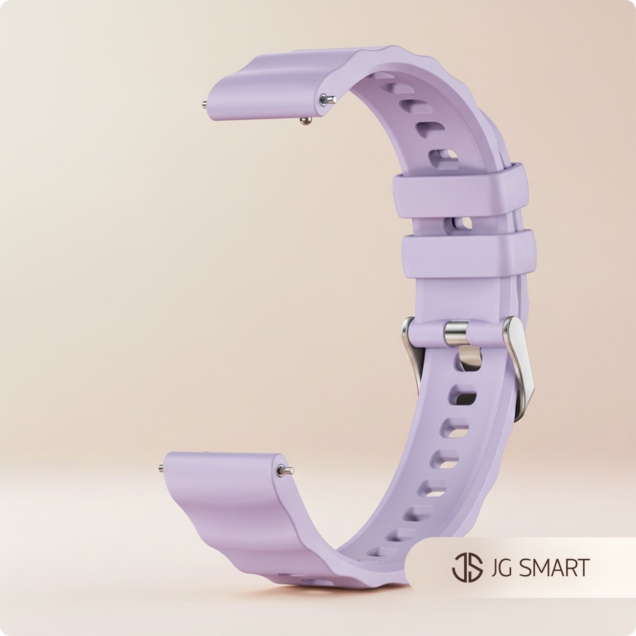 Silikonowy pasek do zegarka w kolorze jasnofioletowym z metalowym zapięciem. W prawym dolnym rogu widoczne jest logo \'JG SMART\'.