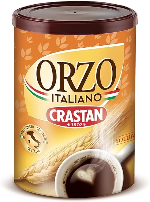 Opakowanie kawy zbożowej Crastan Solubile z napisem \'ORZO ITALIANO\' i logo Crastan na tle zboża oraz filiżanki z napojem.