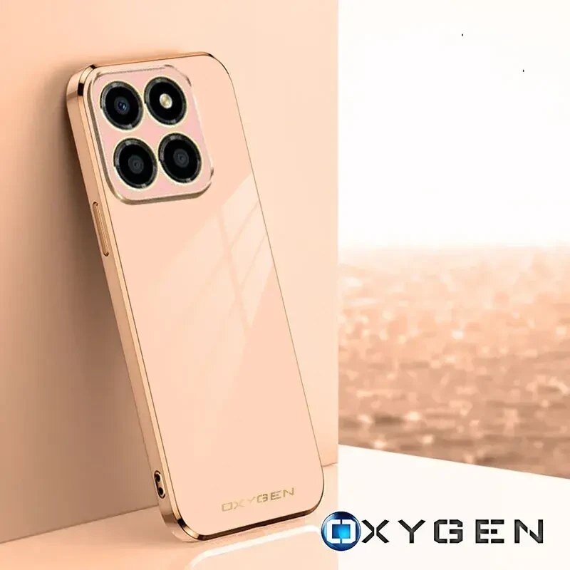 Etui na telefon w kolorze złotym z czterema okrągłymi otworami na aparat. Na dole widoczne jest logo \'OXYGEN\'.