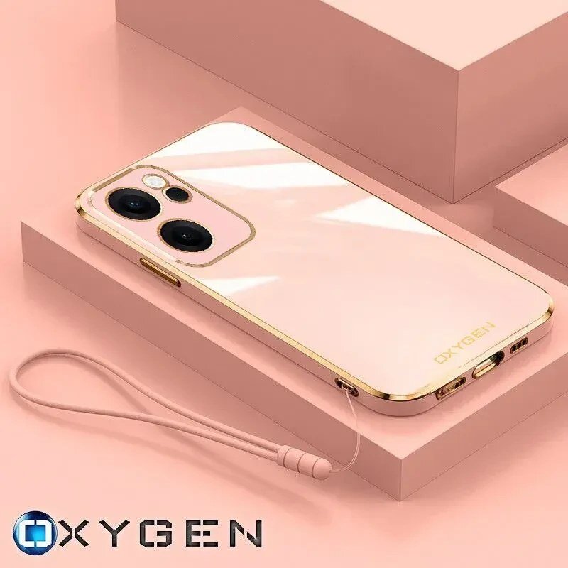 Etui na telefon w kolorze różowym z złotymi akcentami, z widocznym logo \'OXYGEN\'. Obok etui znajduje się różowy pasek na nadgarstek.