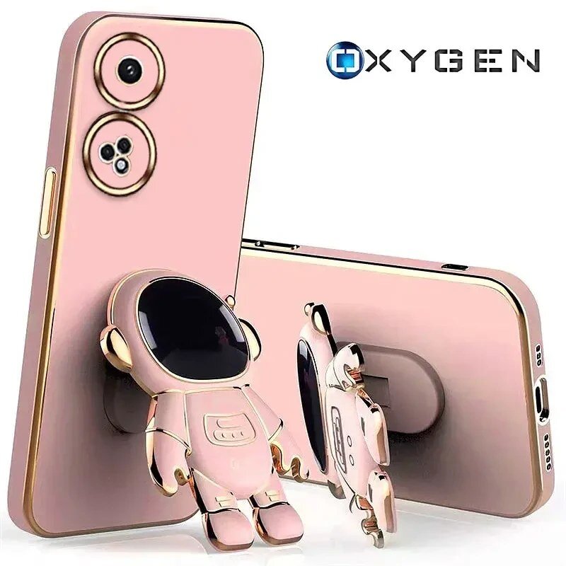 Różowe etui na telefon z motywem astronauty, posiadające dwa otwory na aparaty. Widoczne jest logo \'OXYGEN\'.