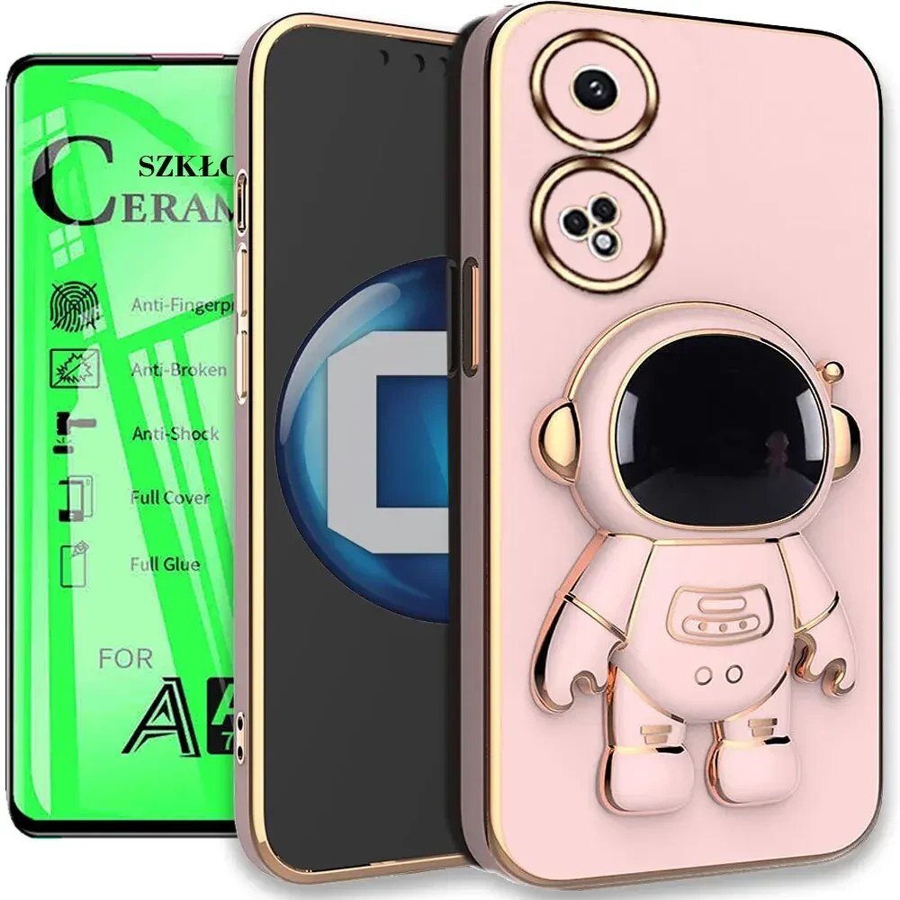 Na obrazie widoczne jest etui na telefon z motywem astronauty oraz szkło ceramiczne z napisem \'SZKŁO CERAMICZNE\'. Etui ma różowy kolor z elementami złotymi, a szkło ceramiczne jest zielone z ikonami wskazującymi na jego właściwości, takie jak \'Anti-Fingerprint\', \'Anti-Broken\', \'Anti-Shock\', \'Full Cover\', \'Full Glue\'.
