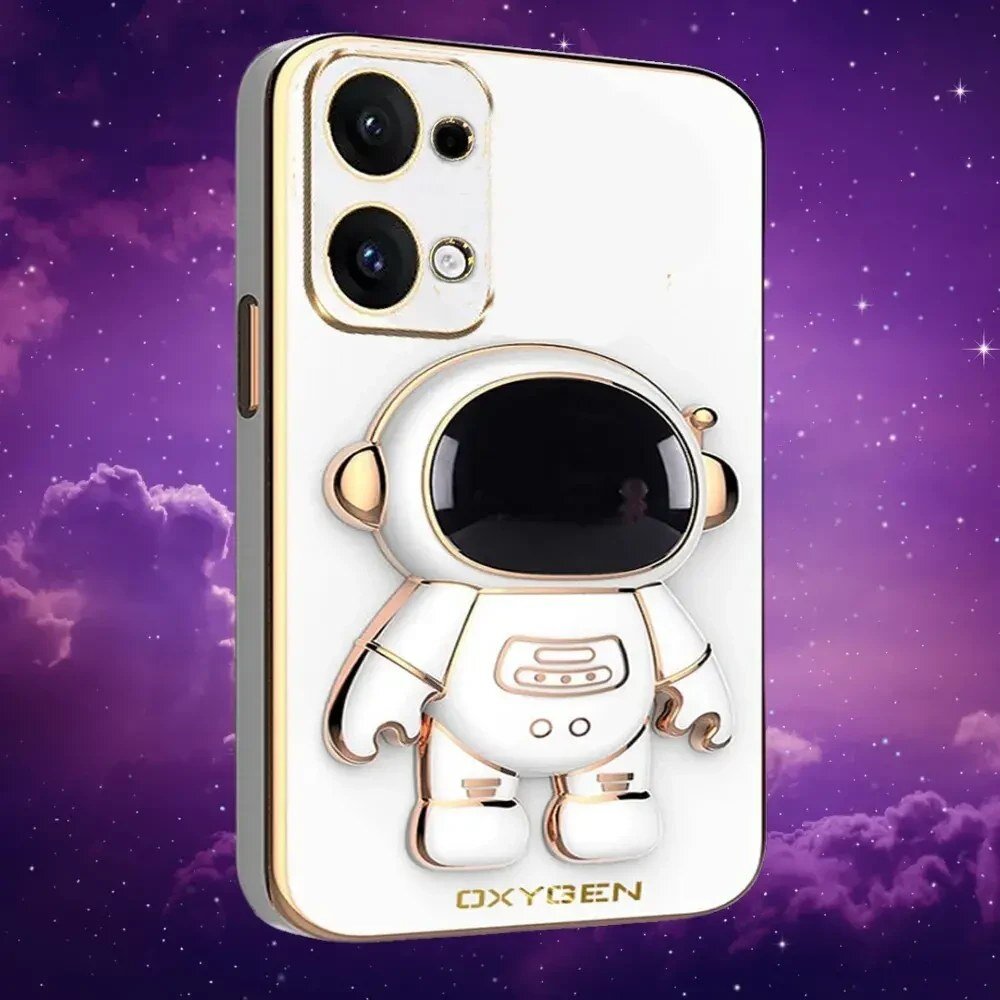 Etui na telefon z motywem astronauty w kolorze białym z elementami złota, z widocznym logo \'OXYGEN\'. Tło jest fioletowe z motywem gwiazd i chmur.