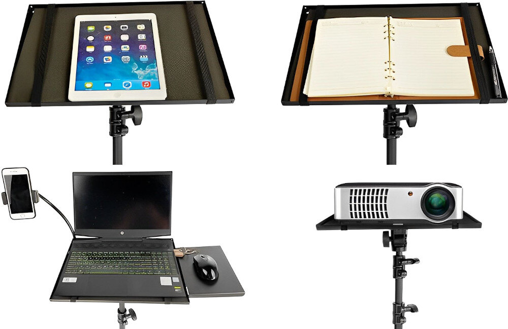 Obraz przedstawia statyw z różnymi urządzeniami: tablet, otwarty notes, laptop z myszką oraz projektor. Statyw posiada regulowane uchwyty i półki na różne sprzęty elektroniczne.