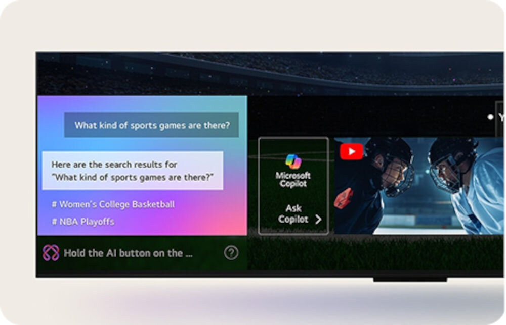 Na ekranie telewizora widoczne są wyniki wyszukiwania dla \'What kind of sports games are there?\', w tym \'Women\'s College Basketball\' i \'NBA Playoffs\'. Obok znajduje się ikona Microsoft Copilot z napisem \'Ask Copilot\'.