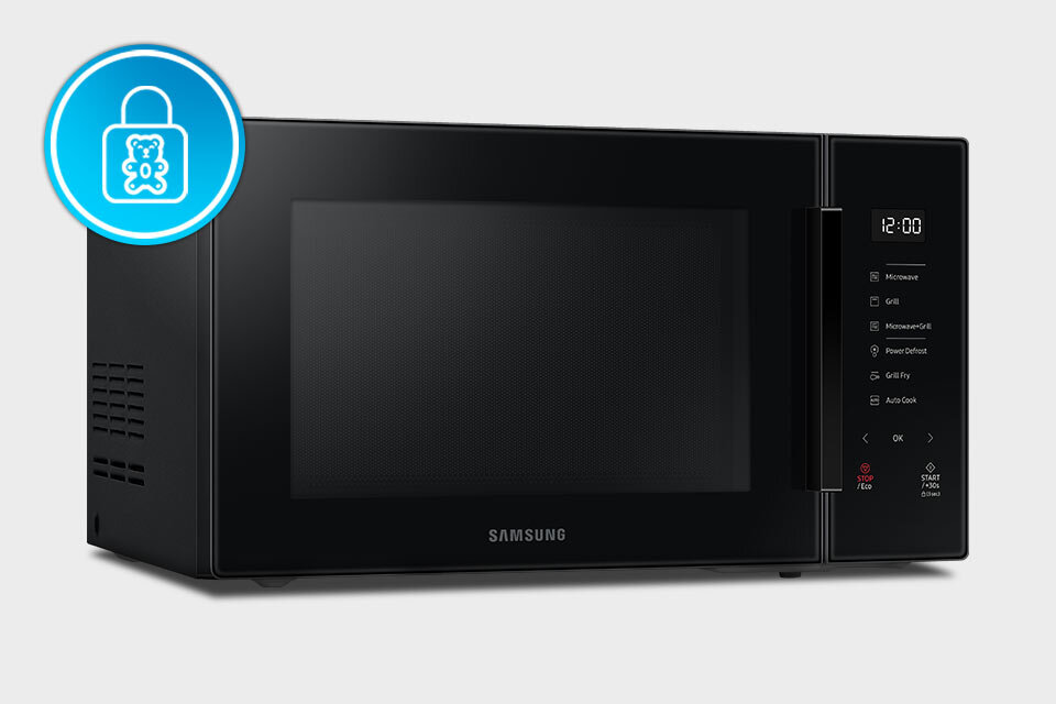 Czarna kuchenka mikrofalowa z wyświetlaczem pokazującym godzinę 12:00 i panelem dotykowym z funkcjami takimi jak Microwave, Grill, Power Defrost. Na drzwiach widoczne jest logo \'SAMSUNG\'.