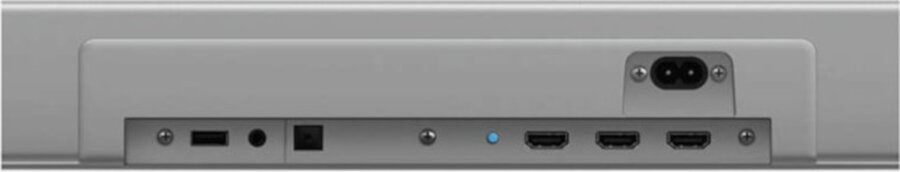 Zdjęcie przedstawia tylny panel soundbara z kilkoma portami, w tym HDMI, USB i zasilania. Obudowa jest srebrna.
