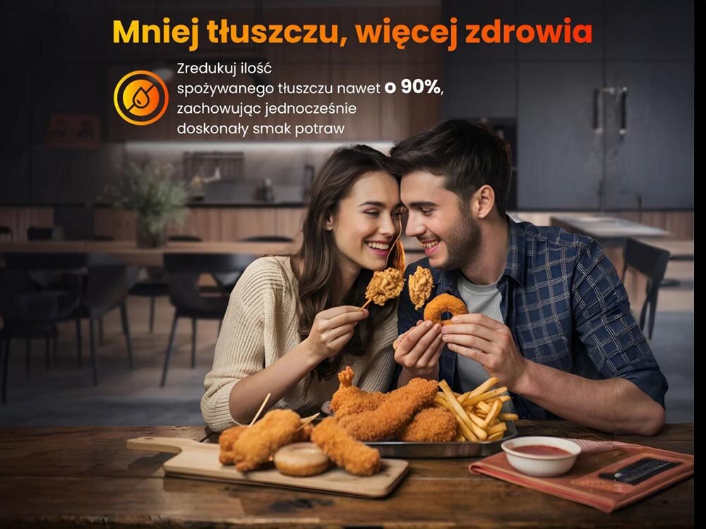 Na obrazie widać dwie osoby siedzące przy stole z jedzeniem, w tle znajduje się kuchnia. Tekst na obrazie: \'Mniej tłuszczu, więcej zdrowia. Zredukuj ilość spożywanego tłuszczu nawet o 90%, zachowując jednocześnie doskonały smak potraw\'.