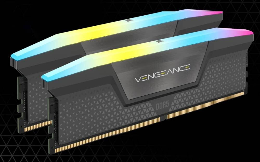 Dwa moduły pamięci RAM z podświetleniem RGB, z widocznym napisem \'VENGEANCE\' oraz oznaczeniem \'DDR5\'. Moduły mają czarną obudowę z geometrycznym wzorem.
