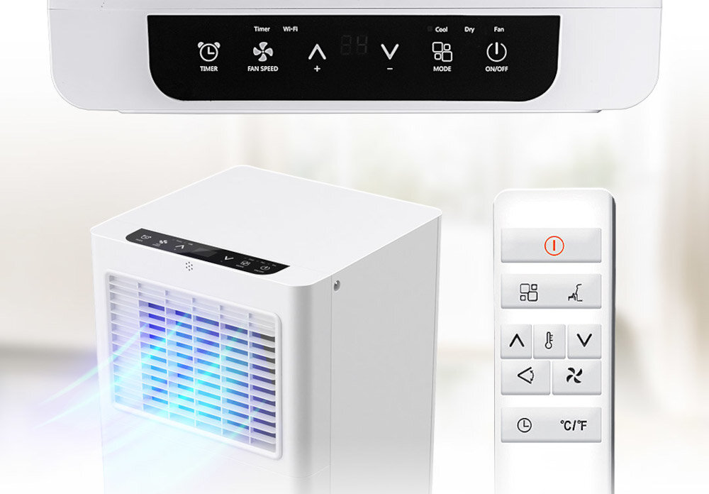 Na obrazie widoczny jest biały klimatyzator przenośny z panelem sterowania oraz pilot z przyciskami. Panel sterowania zawiera ikony: TIMER, FAN SPEED, Wi-Fi, MODE, ON/OFF, a także przyciski ze strzałkami i symbolem plusa i minusa.