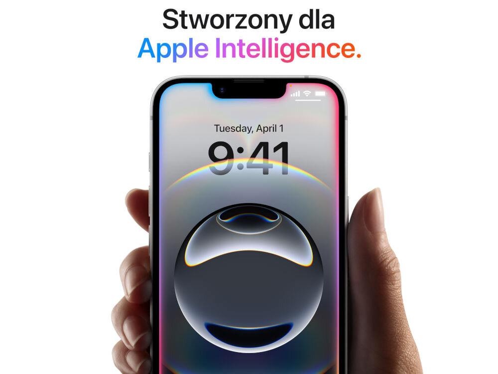 Osoba trzyma smartfon z wyświetlaczem pokazującym godzinę 9:41 i datę Tuesday, April 1. Nad telefonem widnieje napis \'Stworzony dla Apple Intelligence.\'.