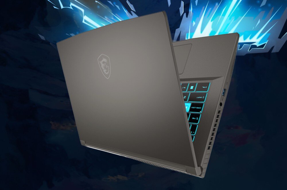 Laptop z widocznym logo producenta na pokrywie, z podświetlaną klawiaturą w kolorze niebieskim. Tło jest dynamiczne, z jasnymi, niebieskimi wzorami.