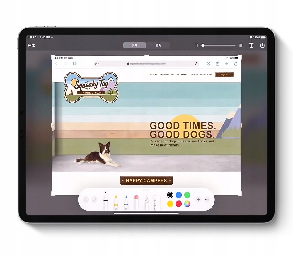Tablet wyświetla stronę internetową z napisem \'GOOD TIMES. GOOD DOGS.\' oraz grafiką psa leżącego na trawie. Na dole ekranu widoczny jest pasek narzędzi z różnymi ikonami i kolorami.