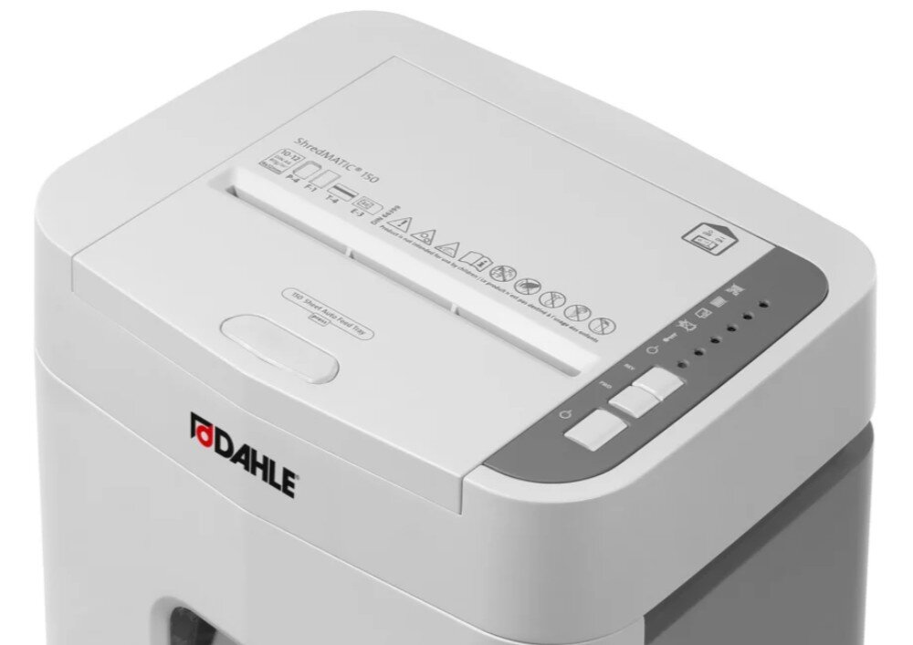 Niszczarka DAHLE ShredMATIC Widok z góry na zamkniętą niszczarkę dokumentów z widoczną szczeliną podawczą, ikonami ostrzegawczymi oraz panelem przycisków