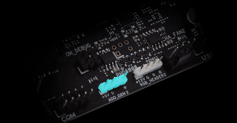 Zbliżenie na fragment płyty głównej z widocznymi złączami i oznaczeniami: \'+5V\', \'ADD_GEN 2\', \'+12V G R B\', \'HEADER2\'.