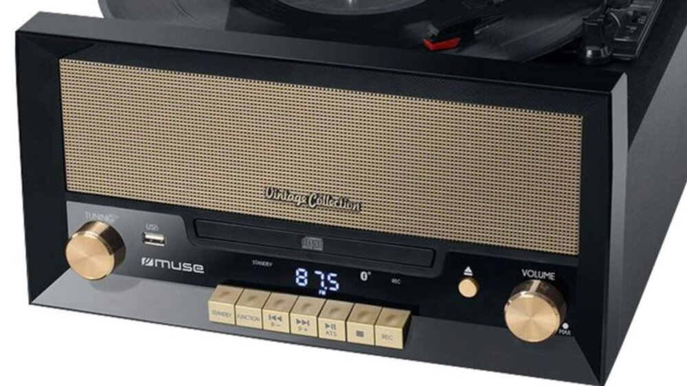 Czarny gramofon z widocznym panelem przednim, na którym znajdują się pokrętła, przyciski oraz wyświetlacz z cyframi 87.5. Na urządzeniu widoczne są napisy \'Vintage Collection\' i \'muse\'.