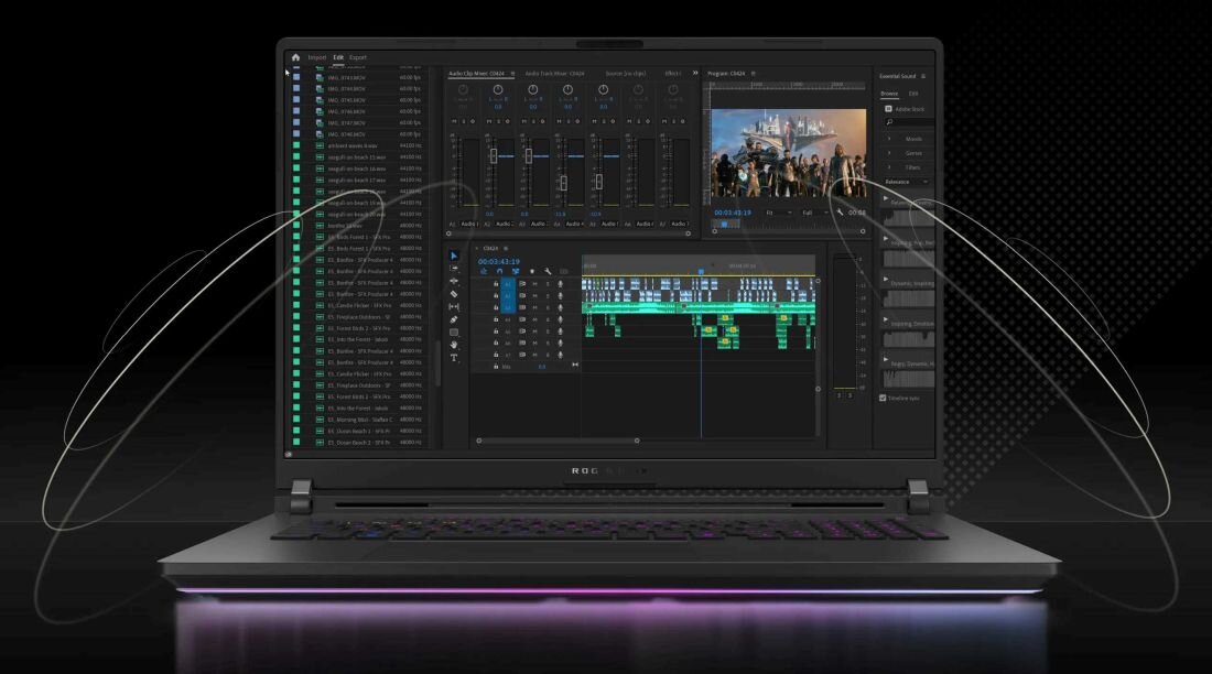 Laptop z dużym ekranem wyświetlającym interfejs oprogramowania do edycji wideo z wieloma ścieżkami i panelami kontrolnymi. Obudowa laptopa jest czarna z podświetleniem RGB na dolnej krawędzi.