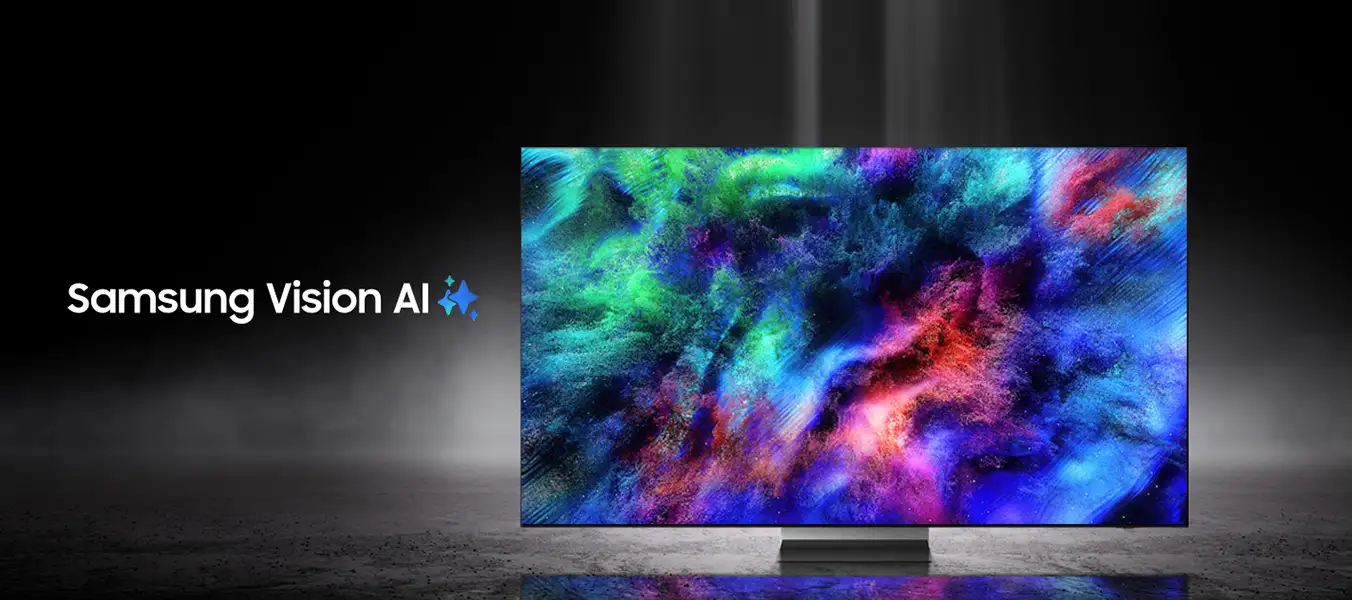 2026-micro-rgb-kv-pc 1352x600 Telewizor wyświetla kolorowy, abstrakcyjny wzór na ekranie. Obok widoczny jest napis \'Samsung Vision AI\'.