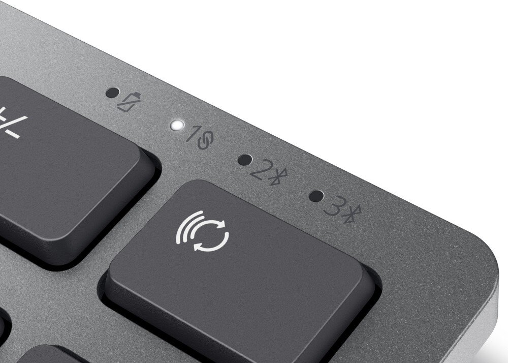 Fragment klawiatury z widocznymi klawiszami i symbolami. Na obudowie znajdują się oznaczenia: \'1\', \'2\', \'3\' oraz symbole Bluetooth.