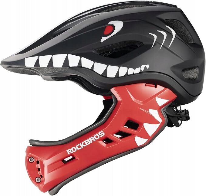 Kask rowerowy dziecięcy fullface z odpinaną szczęką, w kolorach czarnym i czerwonym, z białymi elementami graficznymi przypominającymi zęby i oko. Na czerwonej części widoczny jest napis \'ROCKBROS\'.