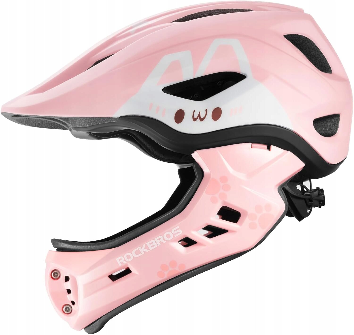 Różowy kask rowerowy dziecięcy fullface z odpinaną szczęką, ozdobiony grafiką przypominającą twarz zwierzęcia i napisem \'ROCKBROS\' na szczęce.