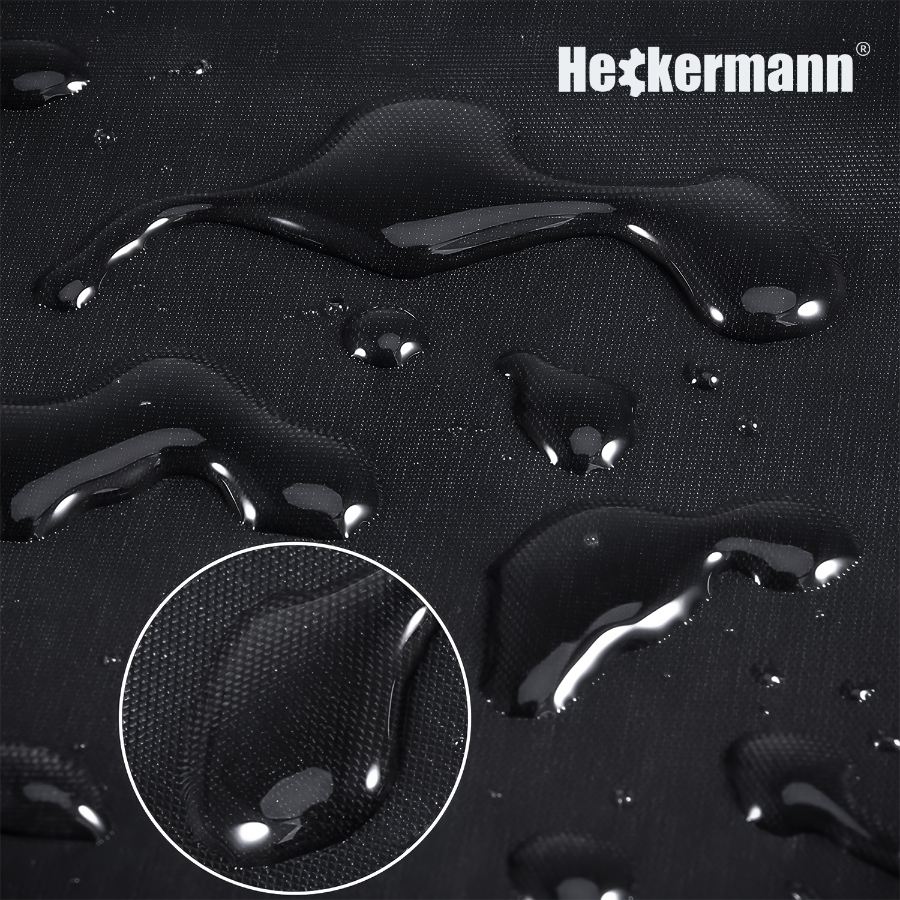 Czarna powierzchnia z kroplami wody, z powiększeniem jednej z kropli w okręgu. W prawym górnym rogu widoczne jest logo \'Heckermann\'.